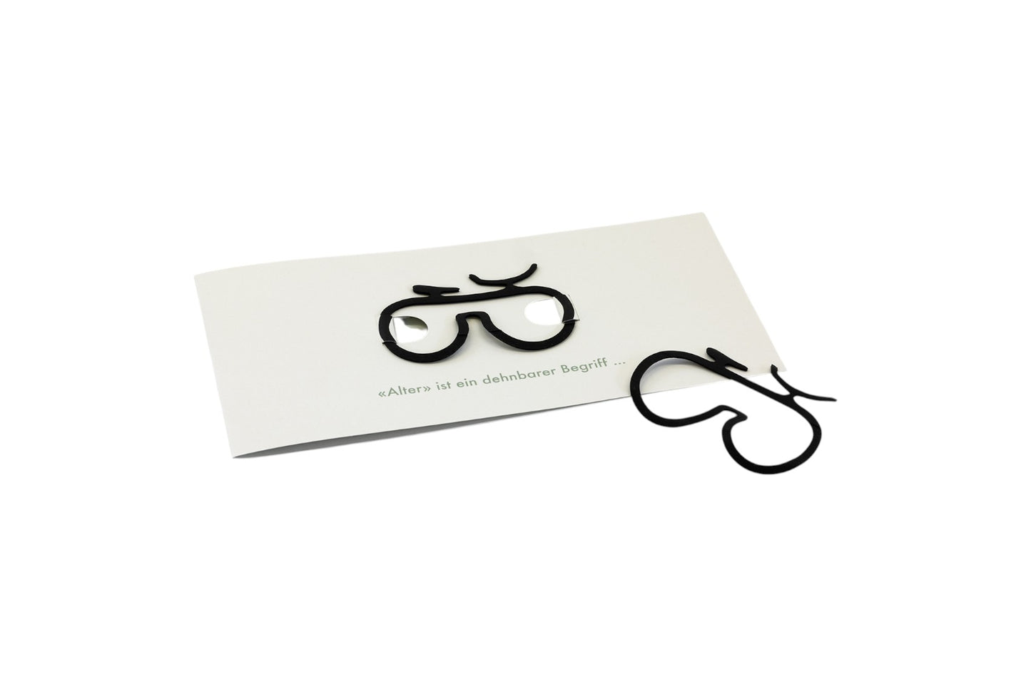 Grusskarte mit lustiger Botschaft und passendem Velogummizug als Geschenkidee