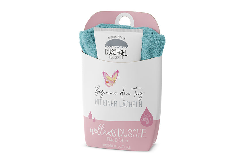Naturkosmetik Wellness-Duschgel und blaues Baumwoll-Handtuch