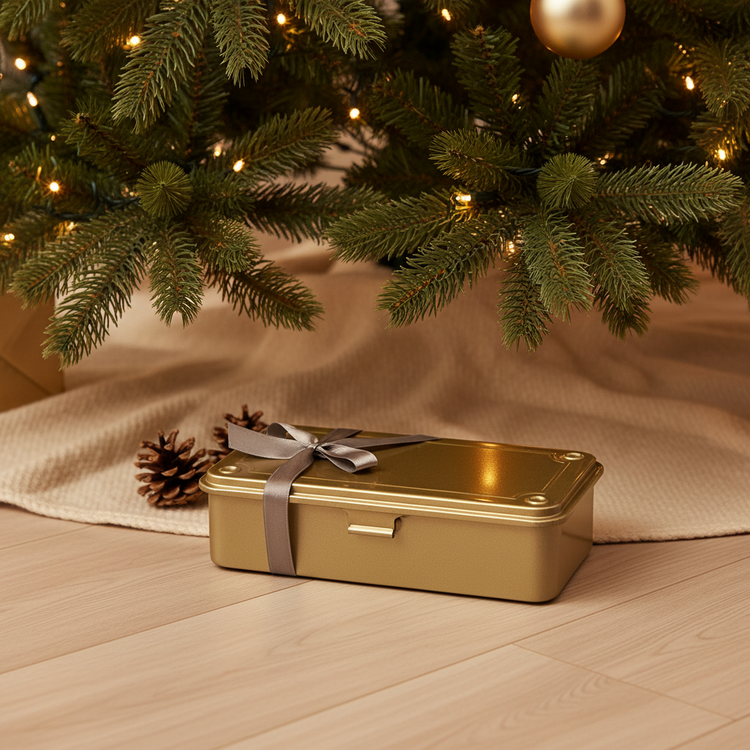 A golden Toyo Tollbox under the Christmas Tree as a present