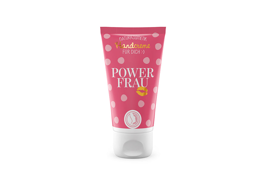 Naturkosmetik-Handcreme in pinkfarbener Tube auf weissem Hintergrund