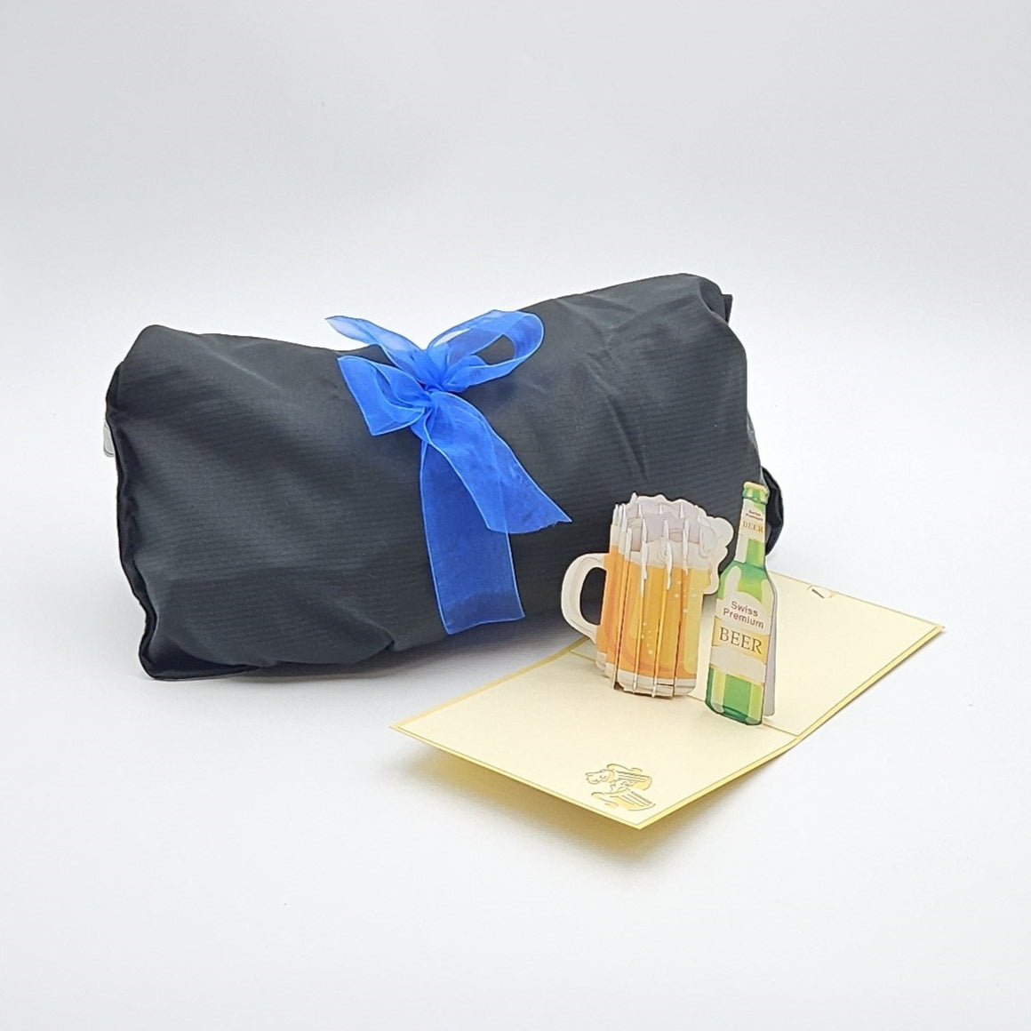 On The Go schwarze Geschenktasche mit blauer Schleife
