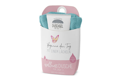 Naturkosmetik Wellness-Duschgel und blaues Baumwoll-Handtuch